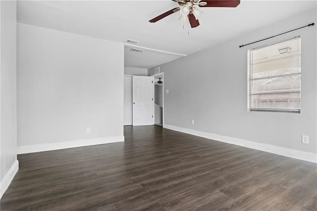 spare room with ceiling fan and dark hardwood / wood-style flooring