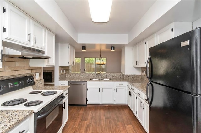 kitchen featuring white electric range, black refrigerator, stainless steel dishwasher, and white cabinetry