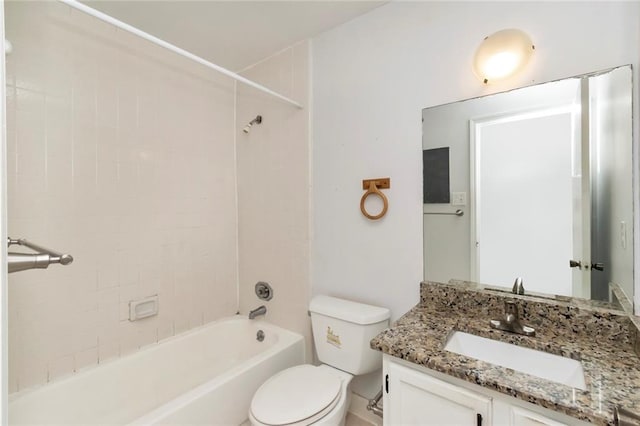 full bathroom with toilet, tiled shower / bath combo, and vanity