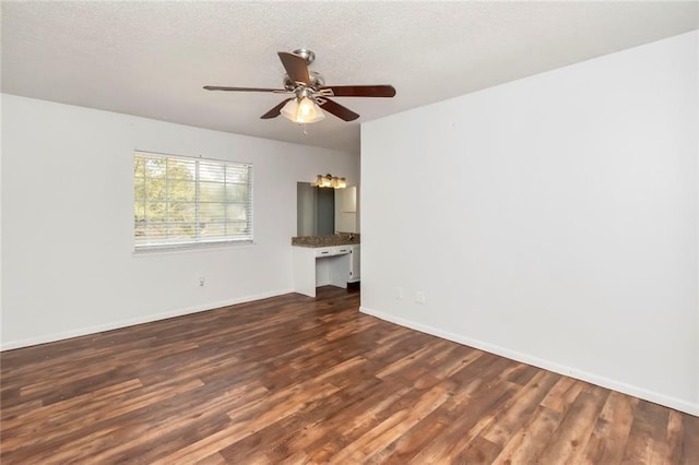 unfurnished living room featuring ceiling fan and wood-type flooring