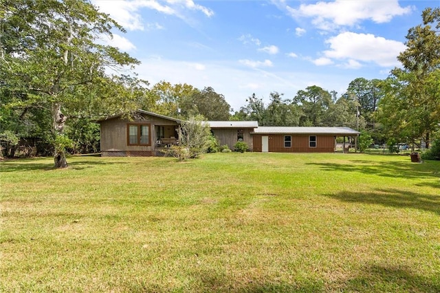 back of house with a yard