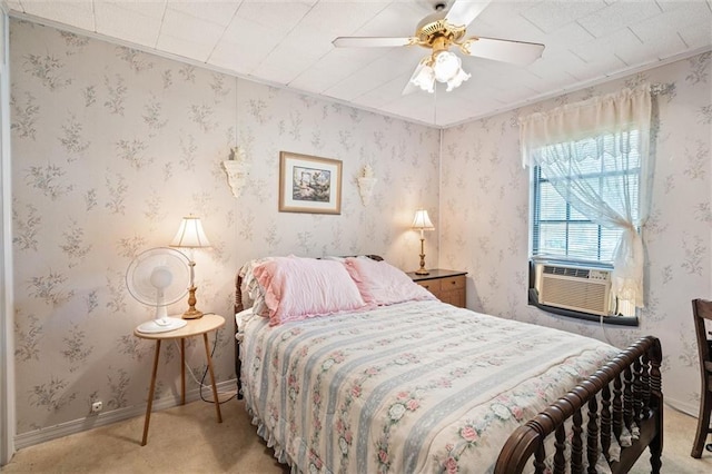 bedroom featuring light carpet, cooling unit, and ceiling fan