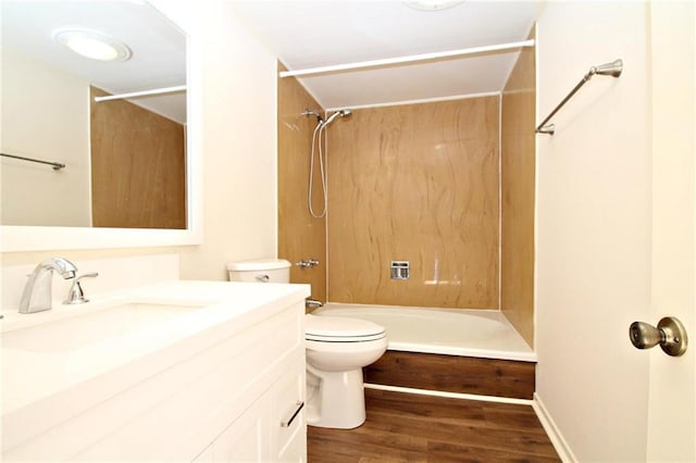 full bath featuring toilet, shower / washtub combination, wood finished floors, and vanity