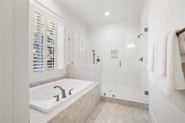 full bath featuring a garden tub, a shower stall, ornamental molding, and tile patterned flooring