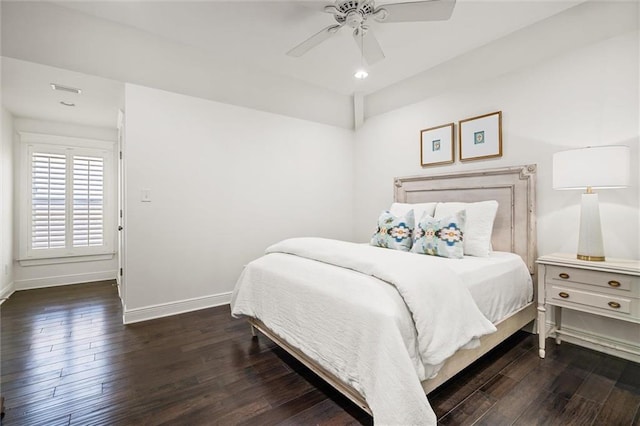 bedroom featuring ceiling fan, baseboards, and hardwood / wood-style flooring