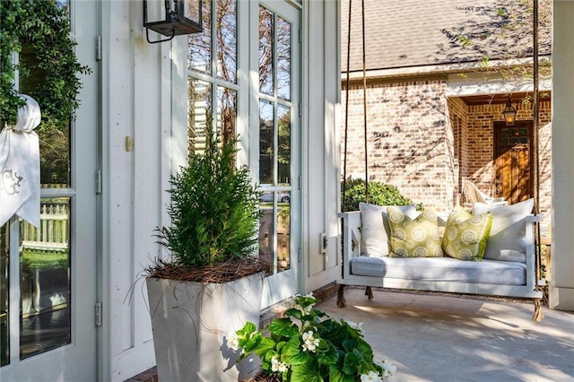 doorway to property with brick siding