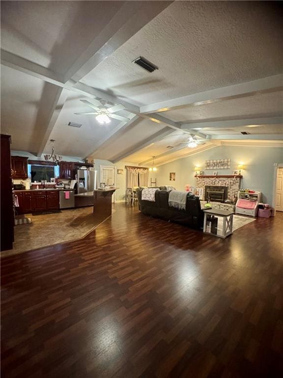 interior space with lofted ceiling with beams, dark hardwood / wood-style floors, and ceiling fan with notable chandelier