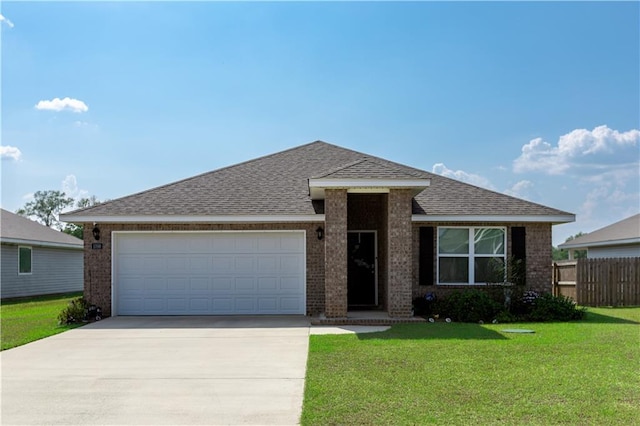 view of front facade with a front yard and a garage