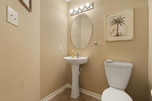 8719 Leven Ct, Mobile, AL 36695 - bathroom with toilet and tile patterned floors