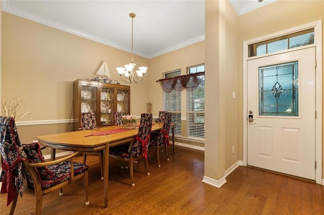 8719 Leven Ct, Mobile, AL 36695 - dining room featuring a chandelier, dark wood-style floors, and crown molding