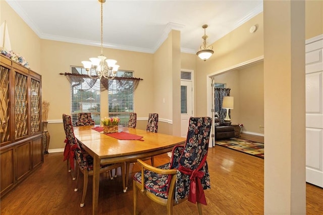 8719 Leven Ct, Mobile, AL 36695 - dining room featuring wood finished floors, a chandelier, and crown molding