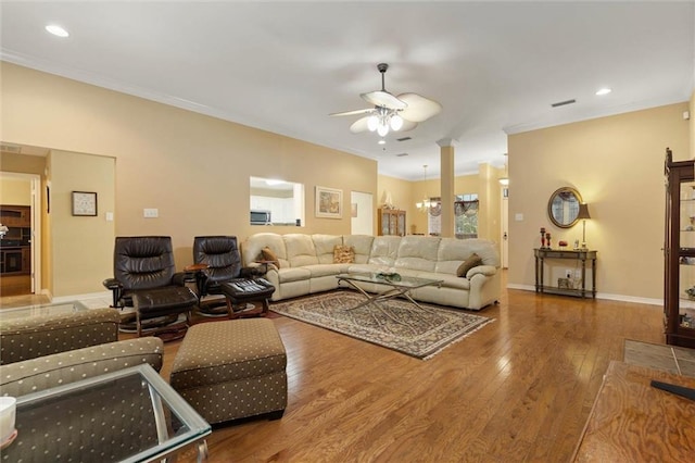 8719 Leven Ct, Mobile, AL 36695 - living room featuring a ceiling fan, wood finished floors, ornamental molding, and recessed lighting