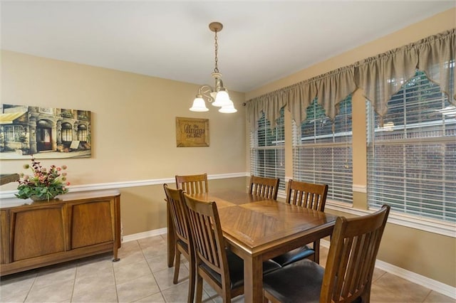8719 Leven Ct, Mobile, AL 36695 - dining area with a chandelier and light tile patterned floors