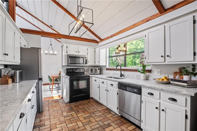 4250 Tara Dr W, Mobile, AL 36619 - kitchen featuring appliances with stainless steel finishes, a chandelier, a sink, white cabinets, and brick patterned flooring