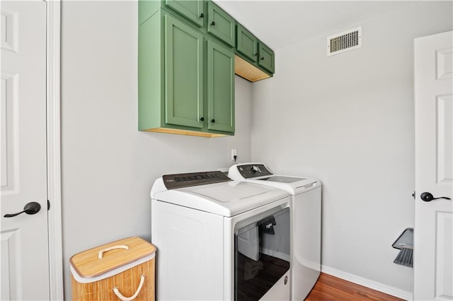 4250 Tara Dr W, Mobile, AL 36619 - washroom with washer and dryer, cabinet space, wood finished floors, and baseboards