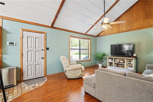 4250 Tara Dr W, Mobile, AL 36619 - living room featuring wood finished floors, vaulted ceiling, a ceiling fan, and baseboards