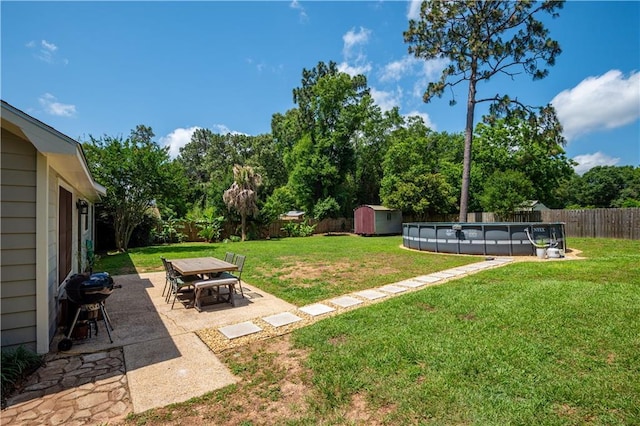 4250 Tara Dr W, Mobile, AL 36619 - view of yard with view of wooded area, outdoor dining area, and a patio