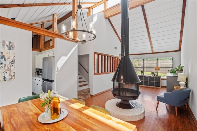 4250 Tara Dr W, Mobile, AL 36619 - dining room featuring a chandelier, wood finished floors, high vaulted ceiling, wooden ceiling with exposed beams, and baseboards