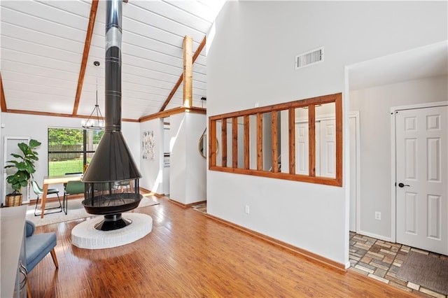 4250 Tara Dr W, Mobile, AL 36619 - living area with a wood stove, wood finished floors, and baseboards