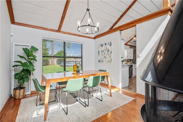 4250 Tara Dr W, Mobile, AL 36619 - dining area with a chandelier, light wood-style floors, and baseboards