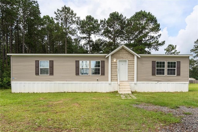 8801 Jack Williams Rd, Wilmer, AL 36587 - manufactured / mobile home featuring entry steps and a front lawn