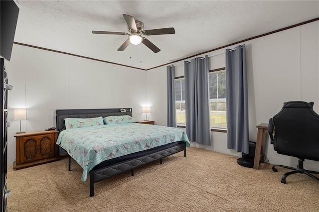 8801 Jack Williams Rd, Wilmer, AL 36587 - bedroom with light carpet, a ceiling fan, a textured ceiling, and ornamental molding