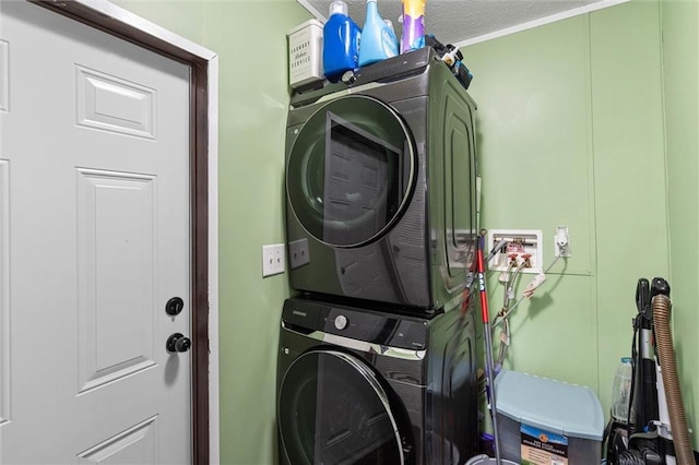 8801 Jack Williams Rd, Wilmer, AL 36587 - laundry area with stacked washing machine and dryer and a textured ceiling