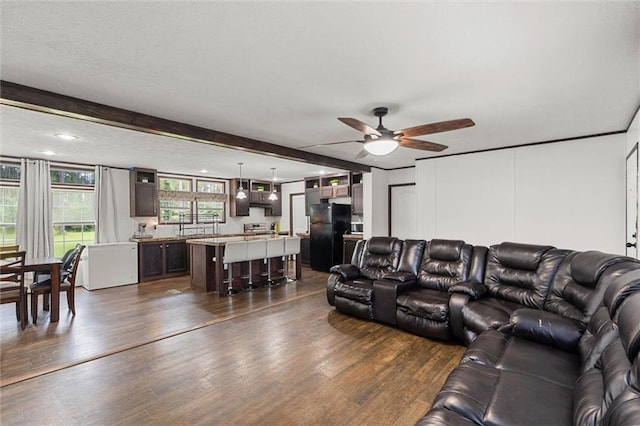 8801 Jack Williams Rd, Wilmer, AL 36587 - living room with dark wood-type flooring, ceiling fan, and beam ceiling