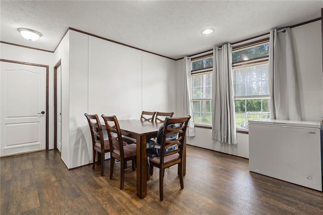 8801 Jack Williams Rd, Wilmer, AL 36587 - dining room featuring a textured ceiling, dark wood finished floors, ornamental molding, and recessed lighting