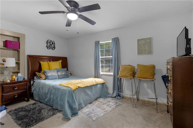 bedroom featuring ceiling fan and light colored carpet