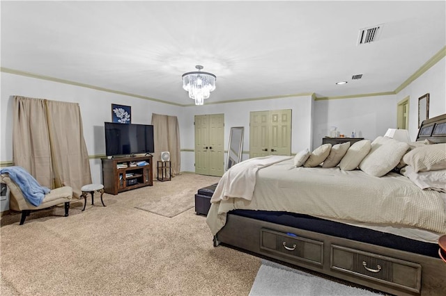 carpeted bedroom with crown molding and an inviting chandelier