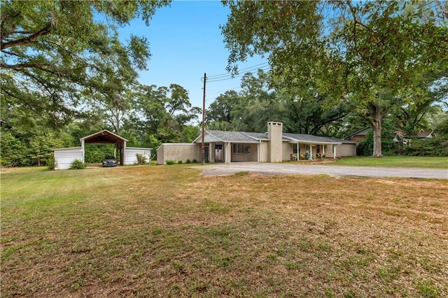 view of front of house with a garage and a front yard