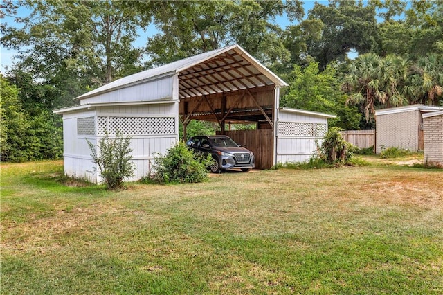 view of home's exterior featuring a yard and a carport