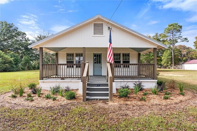 4630 General Rd, Mobile, AL 36619 - view of front of home featuring a porch and a front yard