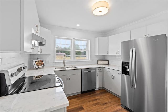 kitchen featuring white cabinets, light stone counters, sink, and stainless steel appliances