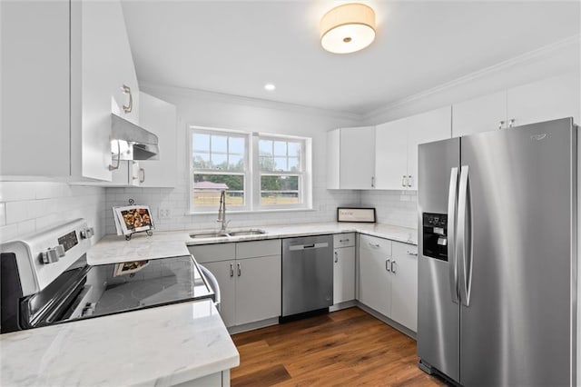 4630 General Rd, Mobile, AL 36619 - kitchen with stainless steel appliances, under cabinet range hood, crown molding, backsplash, and light stone counters