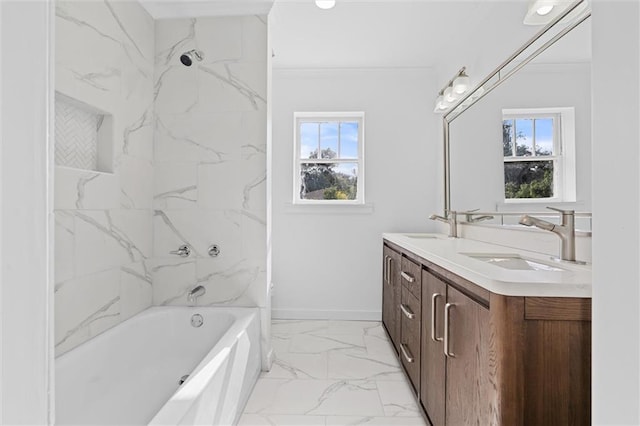 bathroom featuring vanity, a healthy amount of sunlight, tiled shower / bath combo, and ornamental molding