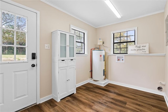 laundry room featuring water heater, plenty of natural light, and dark hardwood / wood-style floors