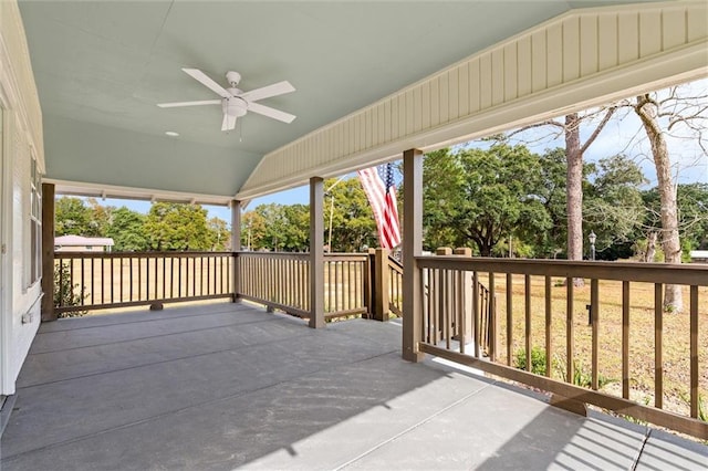 wooden terrace featuring ceiling fan and a porch