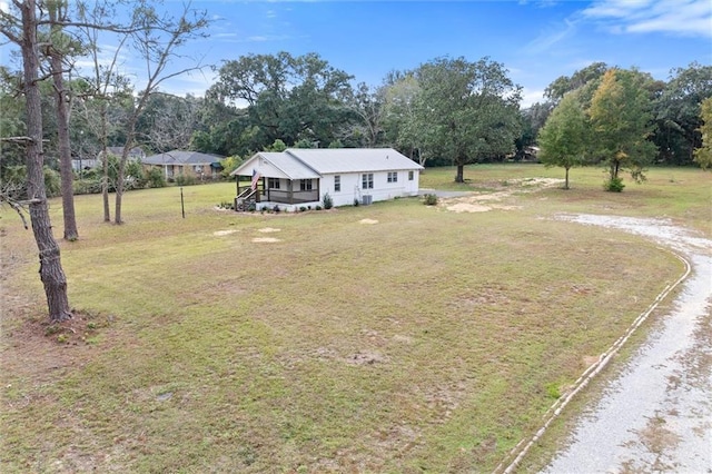 4630 General Rd, Mobile, AL 36619 - view of front of house with dirt driveway and a front lawn