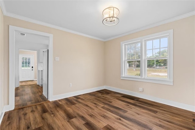 unfurnished room with a chandelier, dark hardwood / wood-style flooring, and crown molding