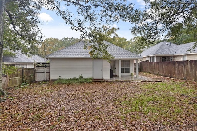 rear view of house featuring a patio