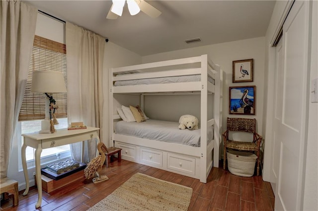 bedroom featuring dark hardwood / wood-style floors and ceiling fan