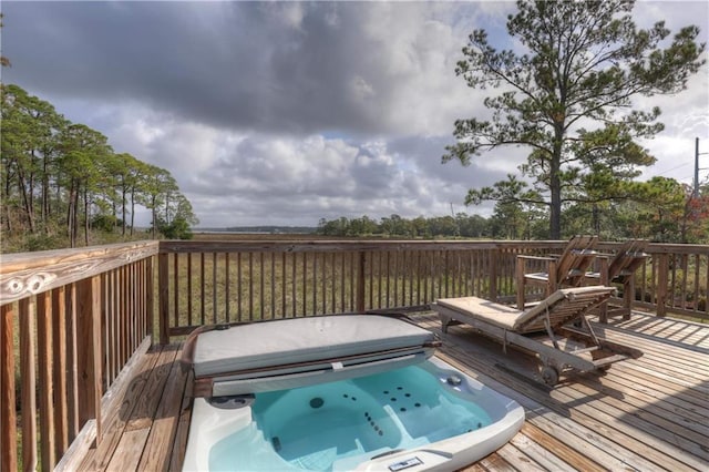 deck with a covered hot tub