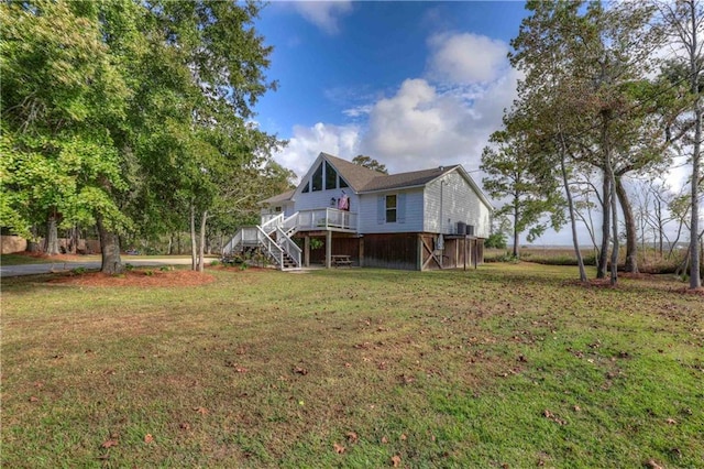 exterior space featuring a wooden deck and a yard