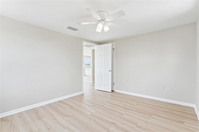 unfurnished room with ceiling fan and light hardwood / wood-style flooring