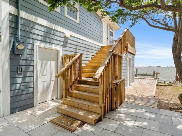 doorway to property featuring a water view