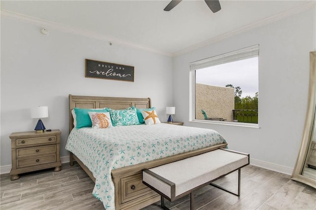 612 Lost Key Dr Unit 205B, Pensacola, FL 32507 - bedroom with light wood finished floors, ornamental molding, baseboards, and a ceiling fan