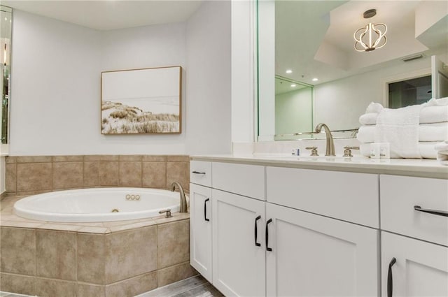 612 Lost Key Dr Unit 205B, Pensacola, FL 32507 - full bath featuring a jetted tub and vanity