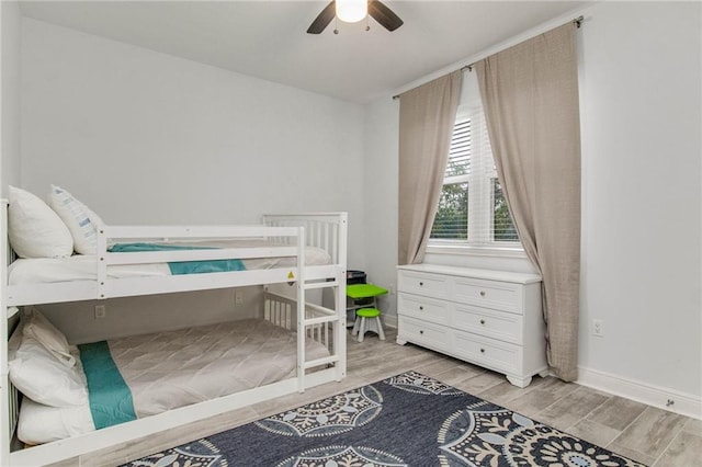 bedroom with ceiling fan and light wood-type flooring